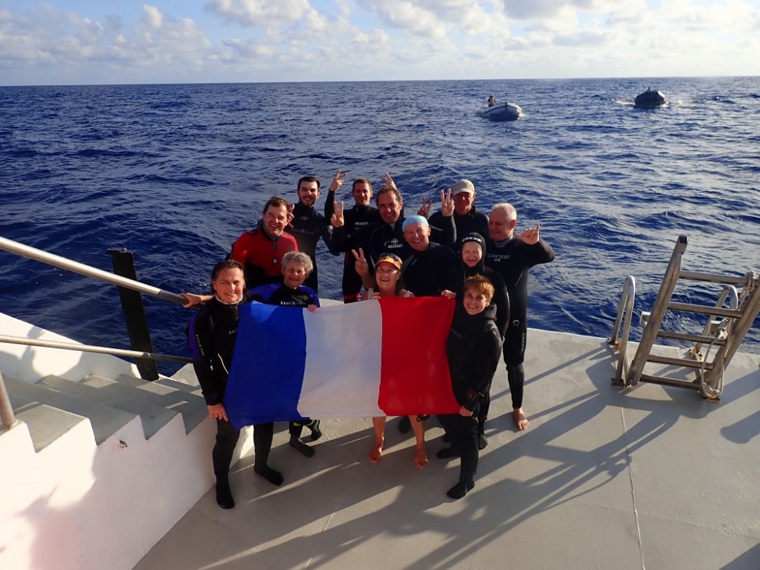 nautilus guests pose on the dive deck
